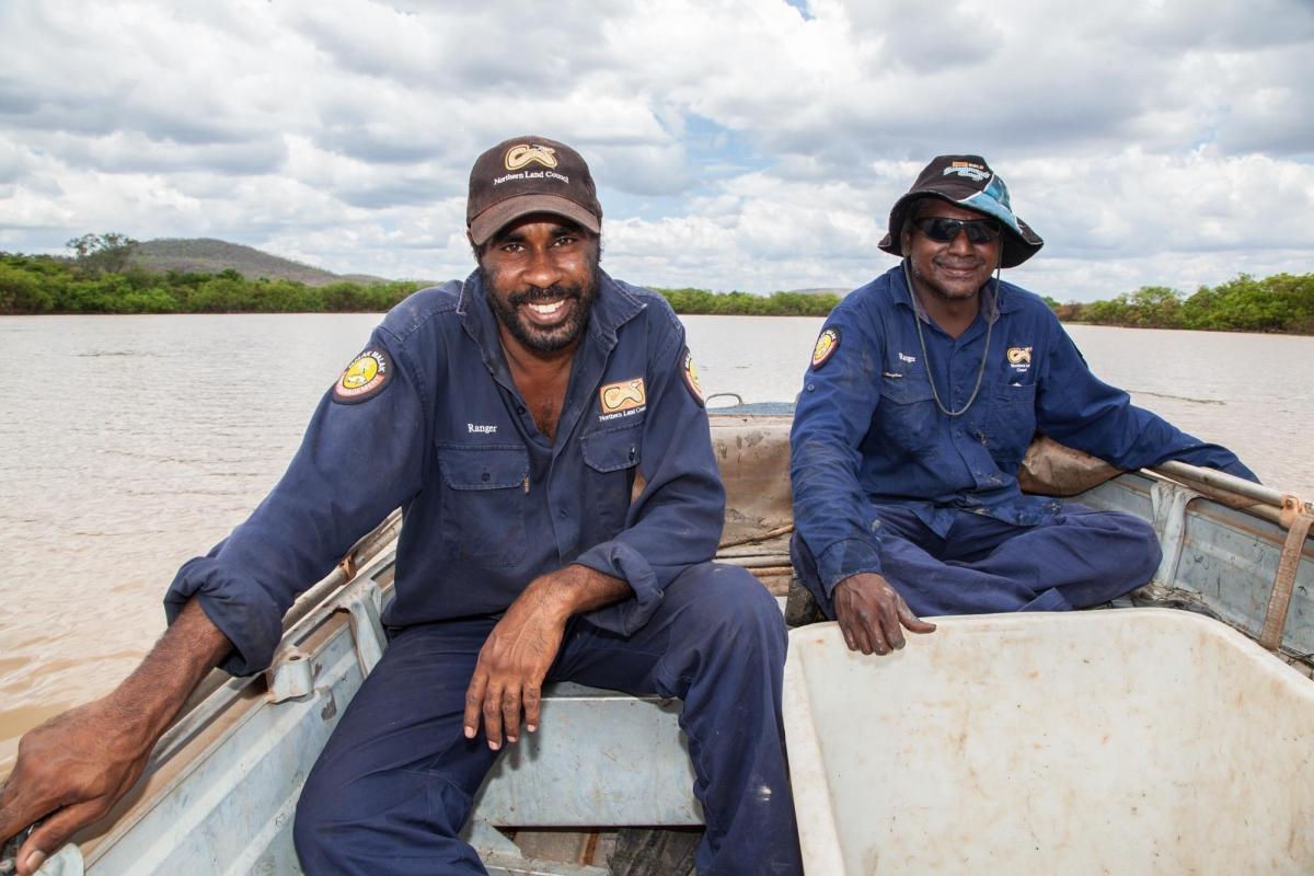 Malak Malak Rangers, Amos and Aaron take a quick break between setting and checking the nets during sawfish surveys. Credit Michael Lawrence-Taylor
