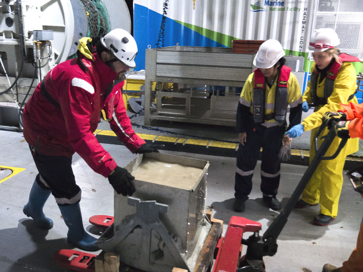 Mark Lewis wheels the box corer across the deck