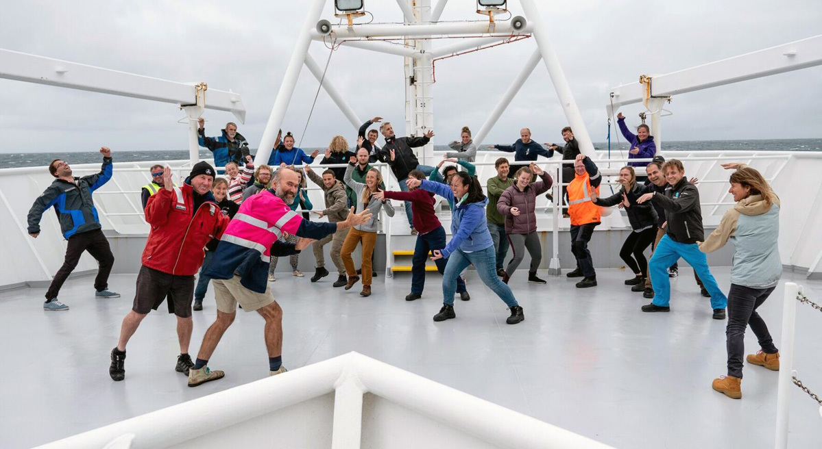 Group photo of scientists on deck