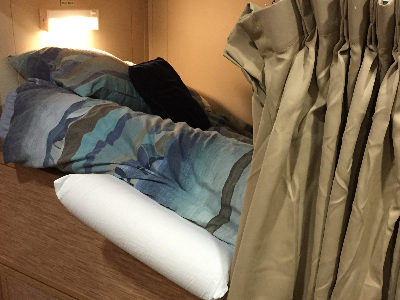 Pillow stuffed into mattress on RV Investigator bed