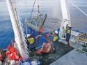 Crew of RV Solander retrieving benthic sled from the seafloor during survey of the Oceanic Shoals.  Image:  AIMS