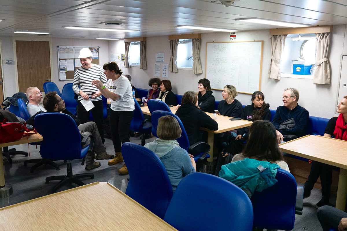The science team meeting in the ship's dining room.